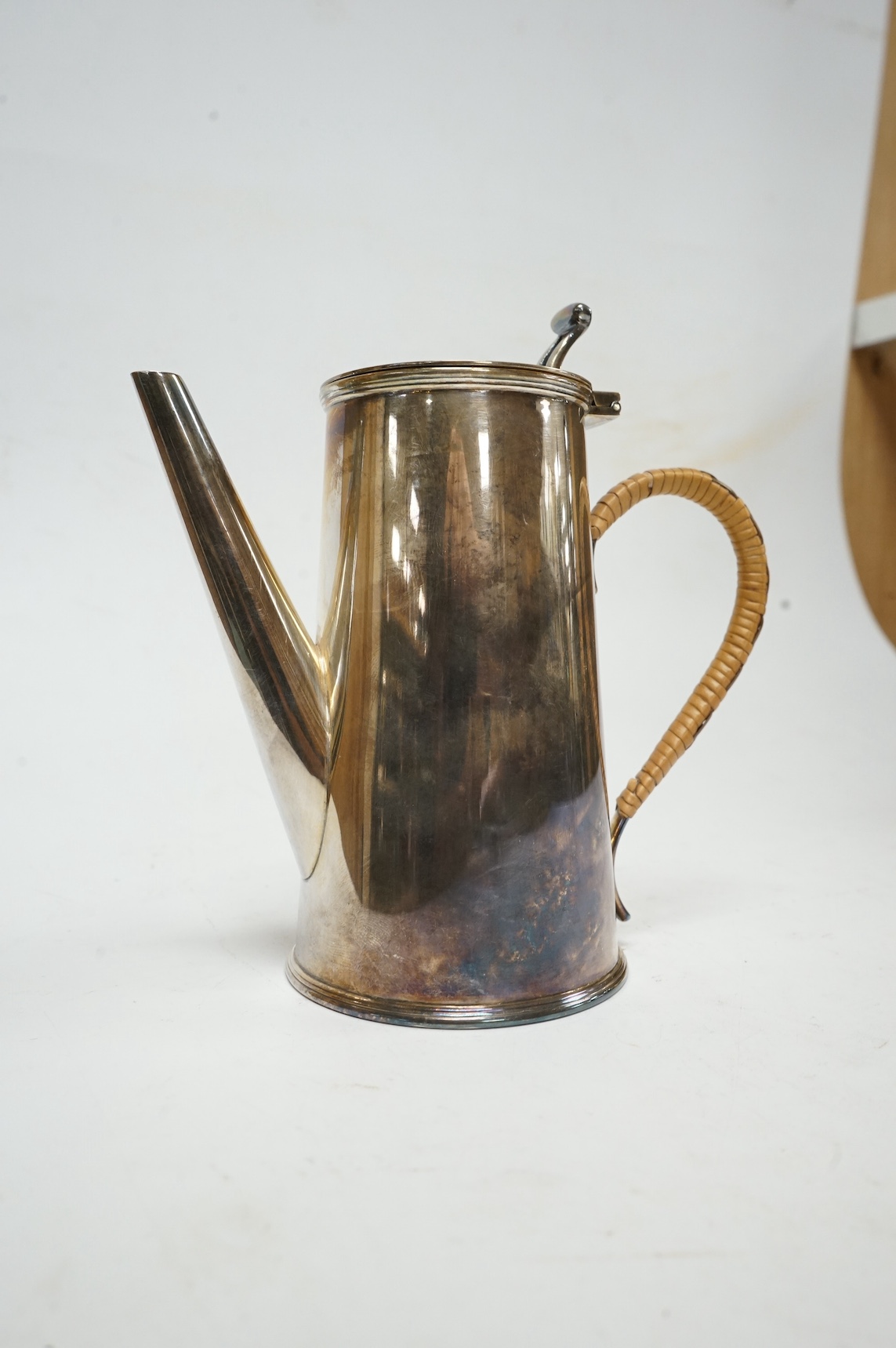 A George V silver hot water pot, with rattan handle, William Suckling Ltd, Birmingham, 1932, 14.2cm, gross weight 8.5oz. Condition - fair